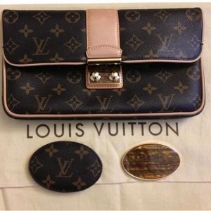 Louis Vuitton
Sofia Coppola Slim Monogram Lv Leather Clutch
11"L x 1"W x…